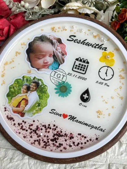 This shot highlights the personalized names of the parents at the bottom, making it a true family memento.