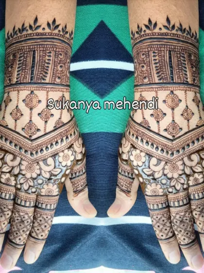 Symmetrical beauty for a festive occasion. These matching designs are filled with traditional Indian motifs, perfect for a bride or for celebrating festivals like Nag Panchami.
