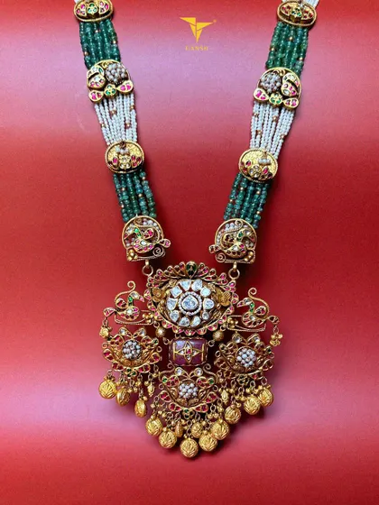 This necklace feels like it is meant for you. Designed with polki diamonds, intricate meenakari, and cascading beads, it is not just jewelry, it is an extension of you.