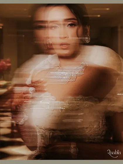 An abstract and artistic bridal portrait using motion blur and light streaks to create a dynamic and modern image.