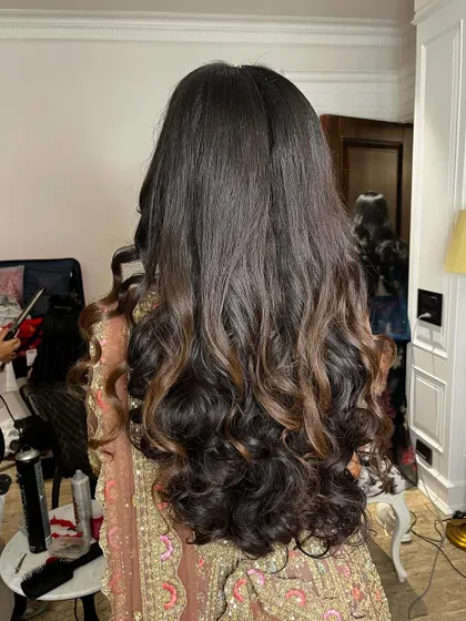 The back view of these rhythmic tresses, a perfect symphony of style for a Sangeet night.