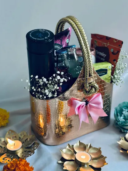 Another view of the metallic basket hamper, showing its elegant design and generous contents.