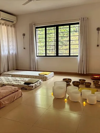 A peaceful studio space prepared for a one-on-one session, complete with mattresses and a variety of sound healing instruments. I provide mentorship to help my graduates thrive as independent studio owners.