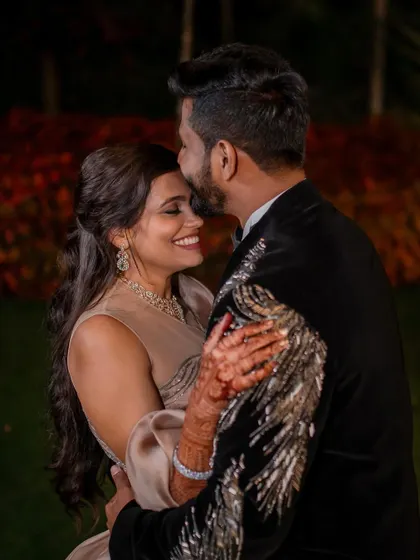 A stylish reception look. We love capturing the glamour and fun of the evening party, from the designer outfits to the happy, candid interactions.
