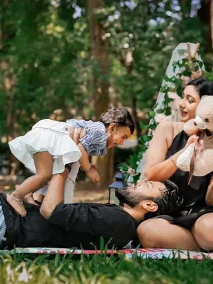 Playtime in the park. This candid shot captures a joyful, active moment during an outdoor family session.