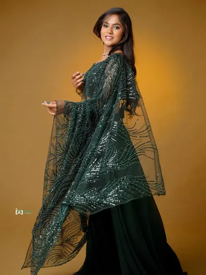 Another dynamic shot with the dupatta in motion. Capturing this movement adds energy and life to a studio portrait.