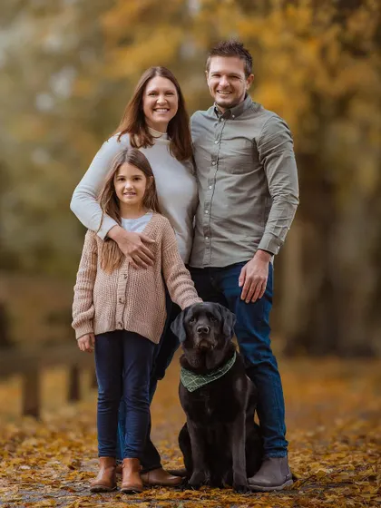 A classic family portrait amidst the autumn colors. Everyone, including the handsome doggo, is looking so happy and relaxed.