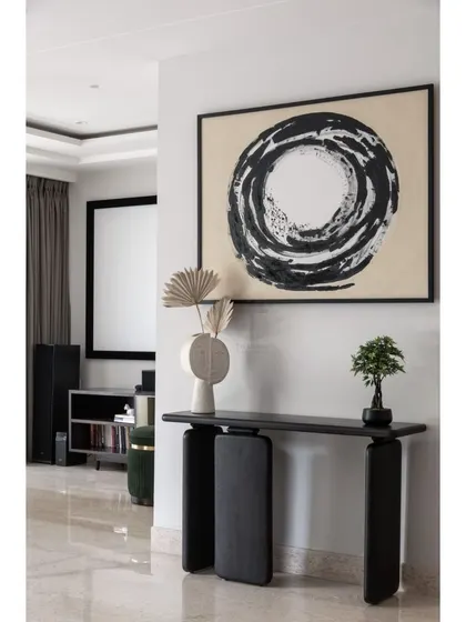 Every space tells a story. This sleek black console provides a foundation for a stunning painting created by our client, turning this corner into a personal and artistic statement.