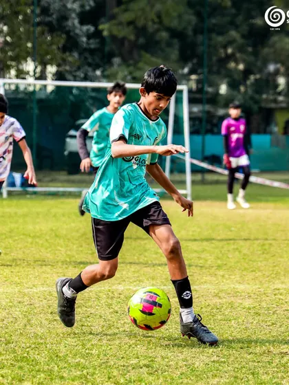A young footballer from Global Sports Coaching on the attack during a Pride Cup match.