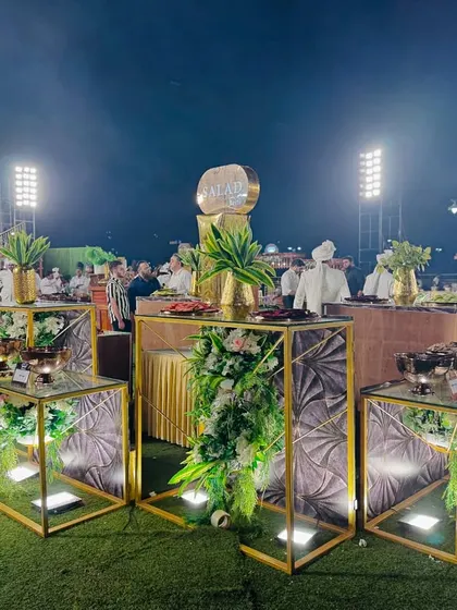 Guests approaching the stylish salad station.