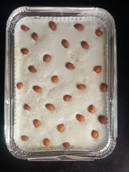 A family-sized tray of our Apricot Delight, ready for a party. The creamy topping and blanched almonds make it as beautiful as it is delicious.