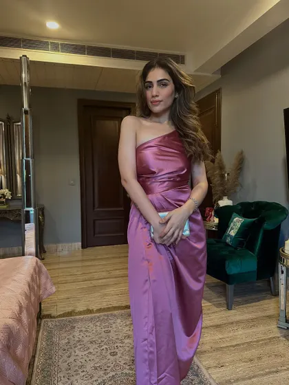 A full-length shot of the pink satin dress. The color is soft yet eye-catching.