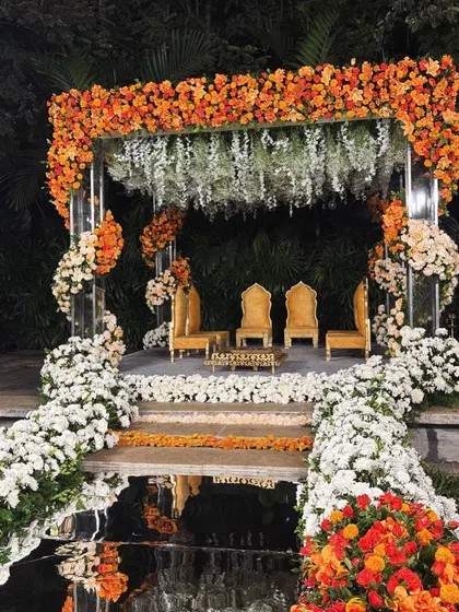 The couple shares a moment in their custom-designed floating mandap, a perfect example of how we create unforgettable experiences, not just decor.