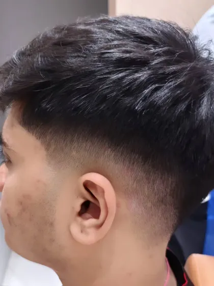 A close-up of the after shot, highlighting the clean fade and textured top.