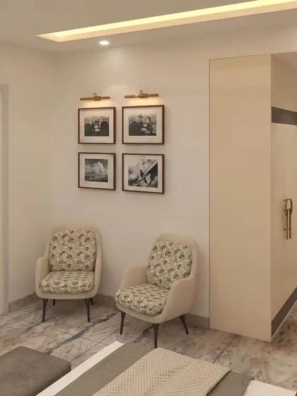A cozy seating area with two floral-print chairs provides a comfortable spot for guests to relax and unwind.