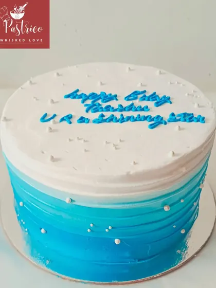 A simple yet beautiful ombre cake in shades of blue, perfect for any celebration.