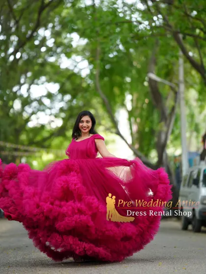 The magenta ruffled gown in motion, creating a beautiful swirl of color and texture.