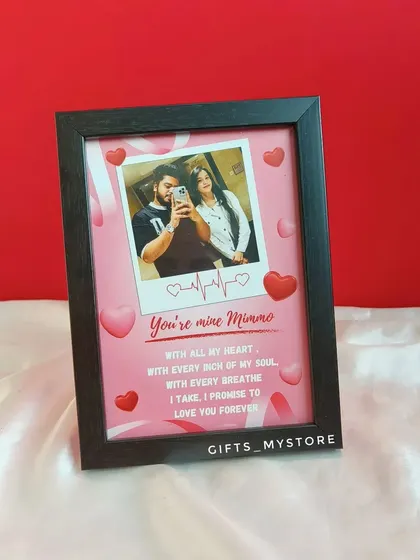 A mini frame for an anniversary, featuring a polaroid-style photo and a sweet, personal message.