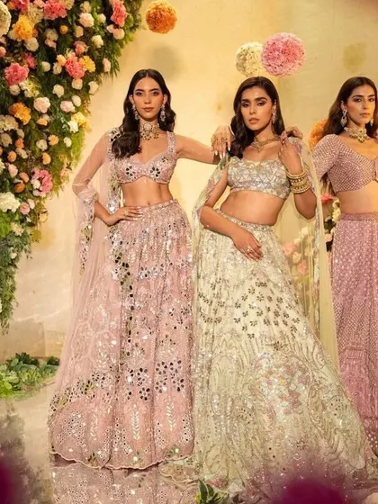 A group shot from the Surabhi Chopra campaign, showcasing three different lehengas from the collection. The styling presents a cohesive color story of pastels, perfect for a spring or summer wedding.