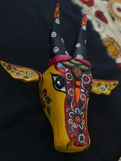 A close-up of my 'K-cow', where K stands for Kalamkari. This view highlights the intricate floral patterns that are a hallmark of this beautiful art form, reinterpreted on a wooden sculpture.