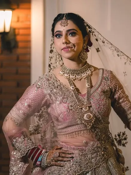 Capturing the bride's personality. This pose is full of grace and attitude, showing off the flow of her veil and the detailed work on her outfit.