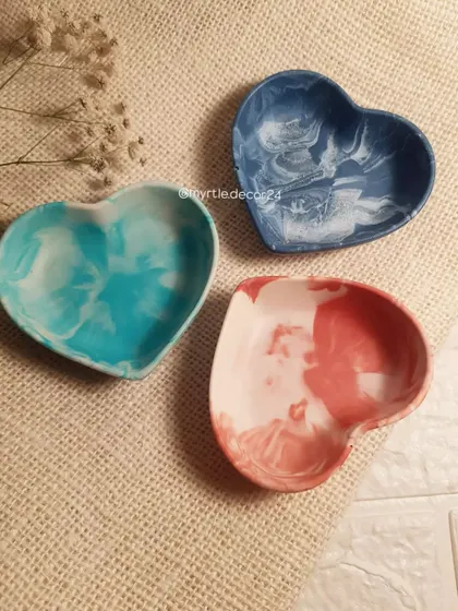 A trio of our mini heart dishes in different marble finishes. These little catch-alls are perfect for rings, earrings, or other tiny treasures.