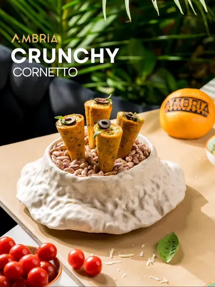 A bite-sized delight with a satisfying crunch. Our Crunchy Cornetto is a savory cone filled with a spiced mixture, offering a playful and delicious start to the meal.