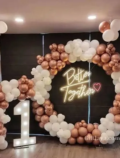 Celebrate your union with this 'Better Together' neon sign backdrop. The circular balloon arch in rose gold and white, paired with a large light-up number '1', makes this a great setup for a first anniversary or engagement party.