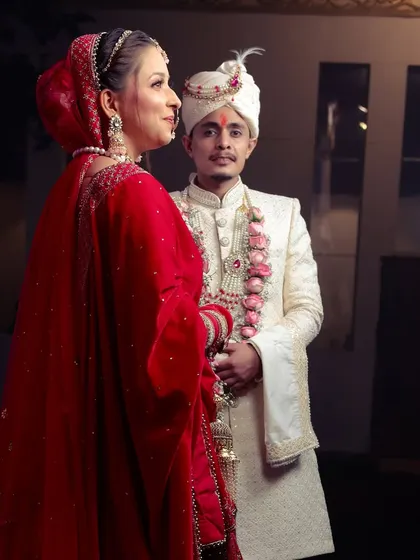 A classic, elegant portrait of the bride and groom, showcasing their stunning wedding attire.