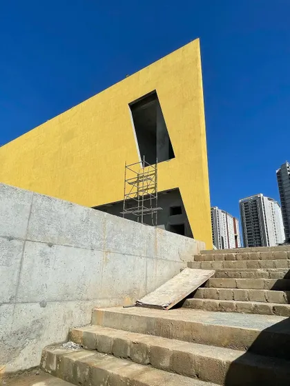 A low-angle shot emphasizing the sharp, angular geometry of the utopia clubhouse facade.