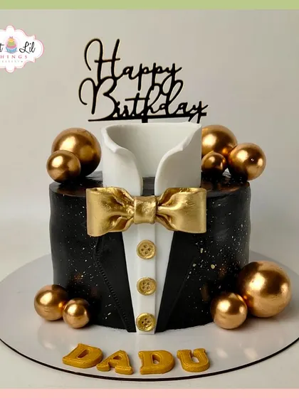 A dapper tuxedo cake for "Dadu's" birthday. This black and gold design is the epitome of class and style for a milestone celebration.