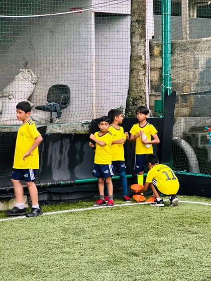 Players taking a short break during training. We ensure our sessions are well-paced with adequate rest.