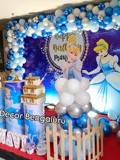 A magical Cinderella theme for a fifth birthday celebration. We used shades of blue, white, and silver to create a royal ball atmosphere, complete with character cutouts, a themed backdrop, and castle-inspired props.