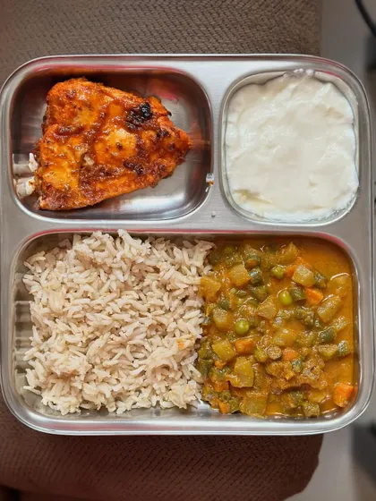 A repeat of the balanced meal with brown rice, mixed vegetable curry, pan-fried fish, and curd.