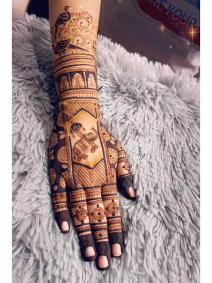 A detailed view of the hand with the elephant in a palanquin.