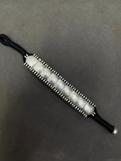 The same beautiful woven bracelet, here with hammered silver squares on a black thread. Perfect for a minimalist, monochrome look.