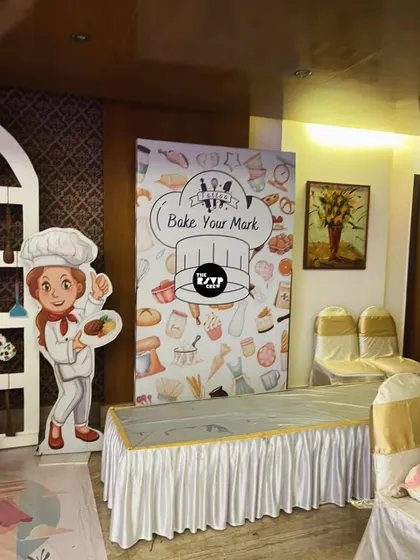 A 'Bake Your Mark' photo booth, where little chefs can pose for pictures.