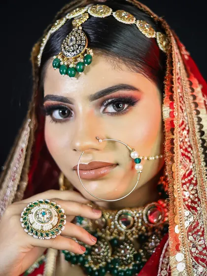 This portrait captures the bride's expression, enhanced by the student's skillful makeup application.