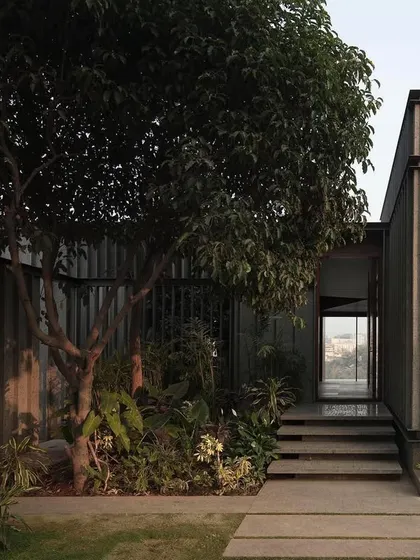 The entry sequence at the Lakehouse is designed to be intentionally opaque, with stone-clad walls concealing the stunning lake views until you step through the front door.