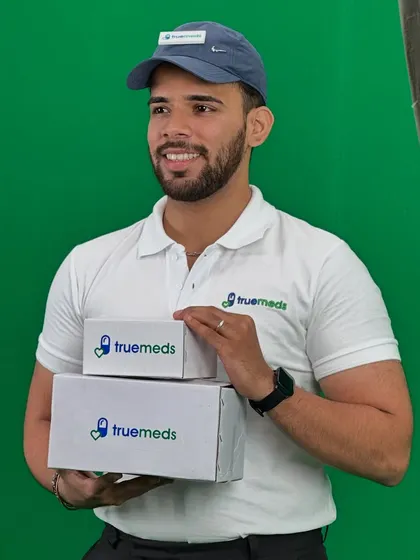 A behind-the-scenes shot from the Truemeds green screen shoot. The makeup is clean and simple, ensuring the actor looks natural and professional.
