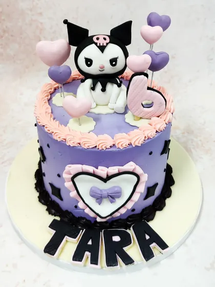 We embrace the cuter side of goth with this adorable Kuromi cake. The popular Sanrio character is surrounded by hearts on a lovely lilac cake, blending her edgy style with sweet pastels for a unique and charming birthday theme.