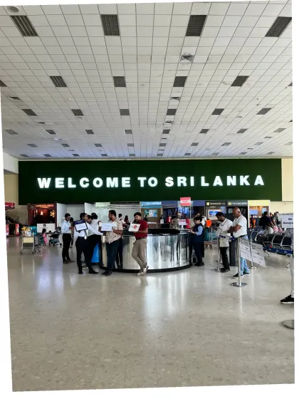 We pause beneath the welcome sign on arrival in Sri Lanka during our November 2025 band trip.