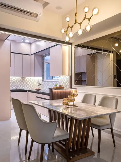 A before-and-after view of this kitchen transformation. By opening up the space and integrating a breakfast counter, I created a more welcoming and social hub for the family.