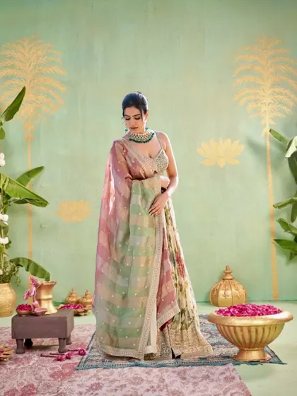 A full-length shot showcasing the entire floral lehenga with its delicate dupatta in a traditional, artistic setting.