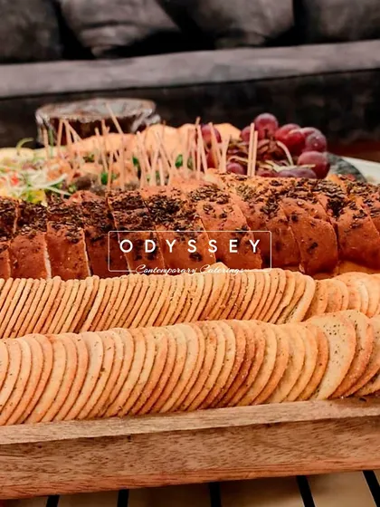 A close-up of our artisanal bread and cracker selection from a CXO dinner. We believe in offering a variety of textures and grains to perfectly complement our cheese and charcuterie offerings.