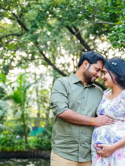 An intimate forehead-to-forehead pose that is full of emotion. This close-up captures the deep connection and shared excitement of the parents-to-be.