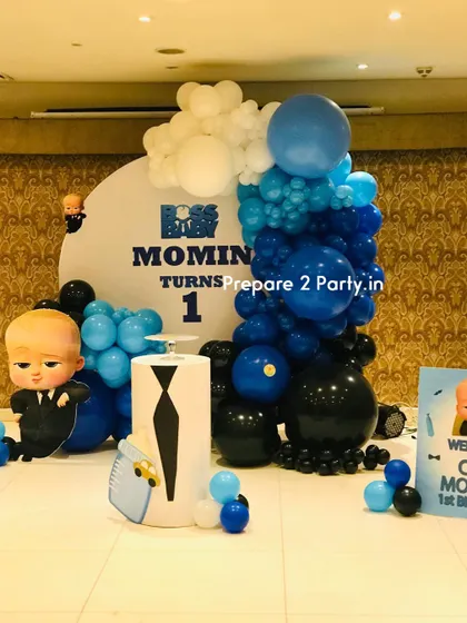 A wide-angle shot of the "Boss Baby" decoration, also showing a welcome sign for the little CEO's first birthday celebration.