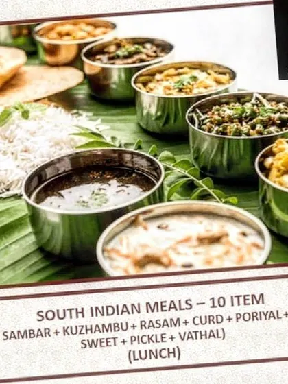 A detailed look at our traditional 10-item South Indian lunch meal. It includes essentials like rice, sambar, kuzhambu, rasam, poriyal, and a sweet, offering an authentic and complete dining experience for your team.