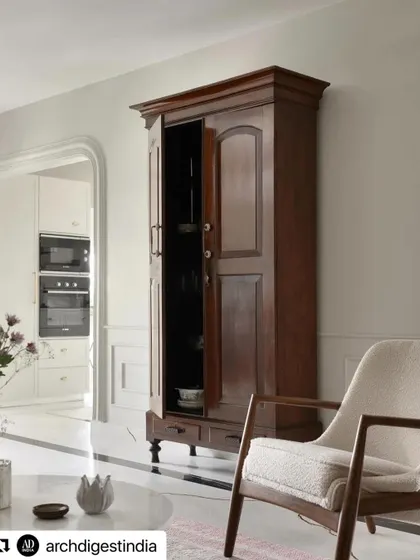 A beautiful colonial-style armoire provides bar storage in the Madras Home. We love mixing aged vintage pieces with new ones to create a collected, timeless feel.