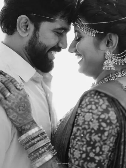 A happy, intimate black and white close-up, their smiles and connection taking center stage.
